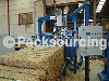 AUTOMATIC STRAPPING MACHINE FOR THE STRAPPING OF STRAW PACKS